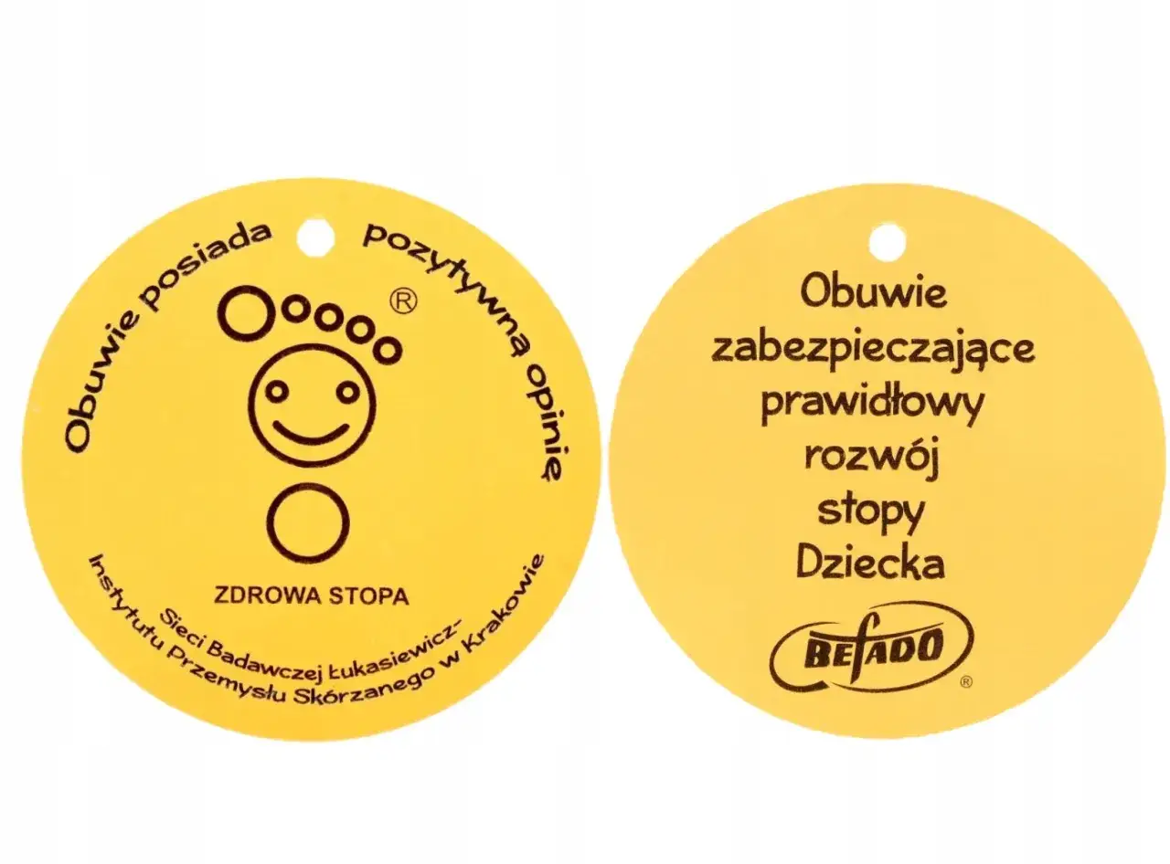 Żółty okrągły znak z napisem 